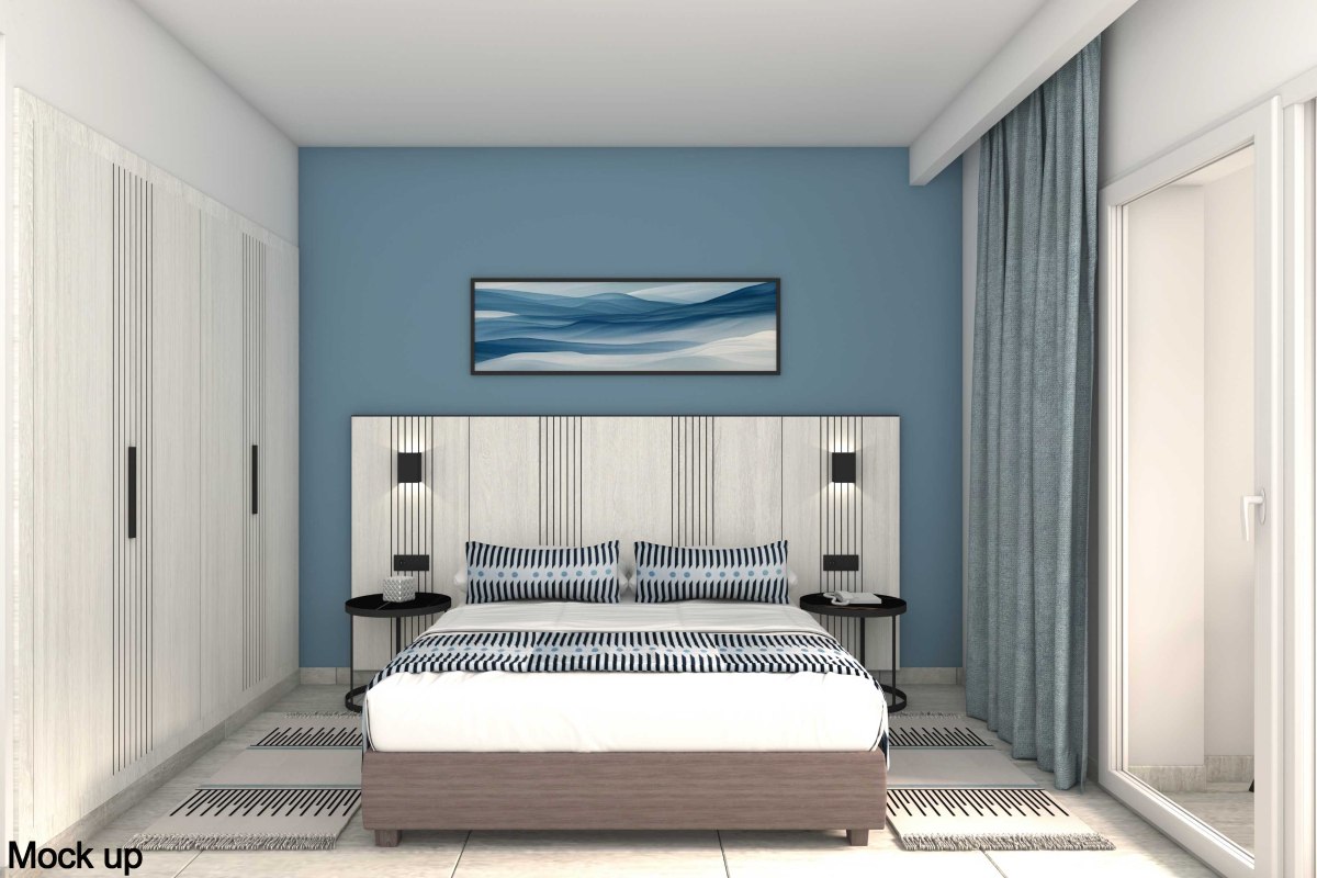 Hell eingerichtetes Hotelzimmer mit zwei Einzelbetten, blauem Sofa, großem Fenster und floralem Wandbild.