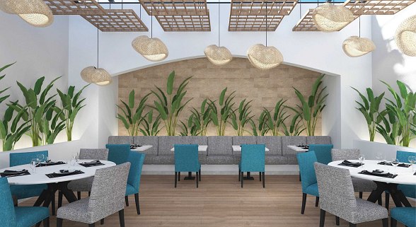 Eleganter Restaurantbereich mit weiß gedeckten Tischen, dekorativen Tellern an der Wand und stilvoller Atmosphäre.