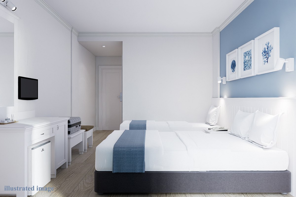 Modern hotel room with two beds, blue accents, a desk, and minimalist decor.